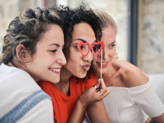 three people taking a selfie